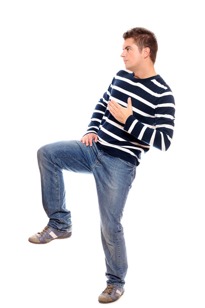 νεαρός άνδρας στέκεται στο ένα πόδι - Φωτογραφία, εικόνα