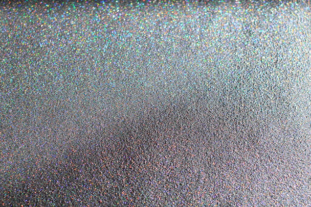 Bright abstract glitter texture dark background with dynamic design  - Photo, Image