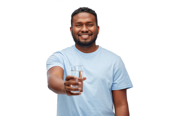 happy african american man with glass of water - Foto, afbeelding