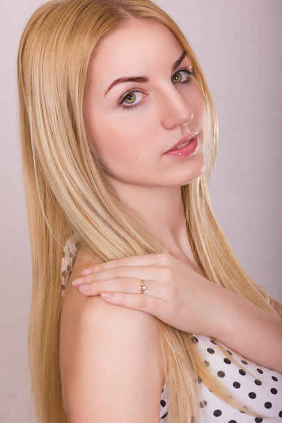Studio portrait of a beautiful young blonde woman with natural make-up - Foto, Imagen