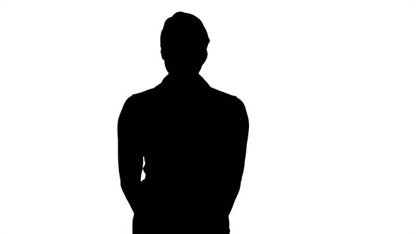 Silhouette Portrait of a young beautiful girl standing looking s - Foto, afbeelding