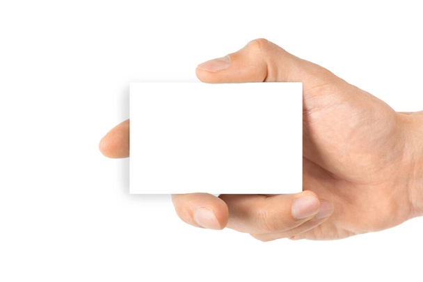 空白の白いカード。白を基調とした空白の名刺を手に持ちます。人の腕の中で空のクレジットテンプレート - 写真・画像