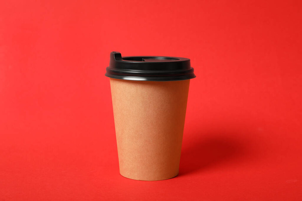 Takeaway paper coffee cup on red background - Фото, зображення