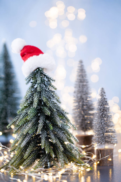 Christmas tree on blue bokeh background. - Foto, Imagen