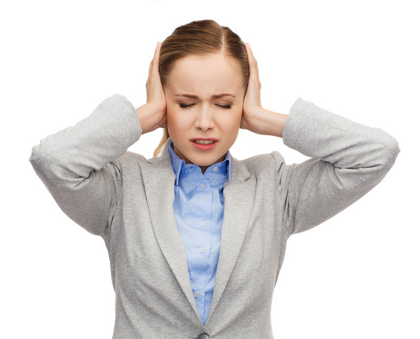 Stressed businesswoman with covered ears - Foto, imagen