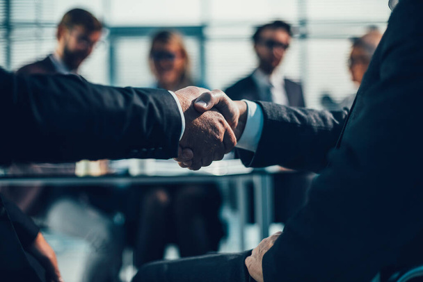 close up. business partners shaking hands during a business meeting - Foto, Imagem