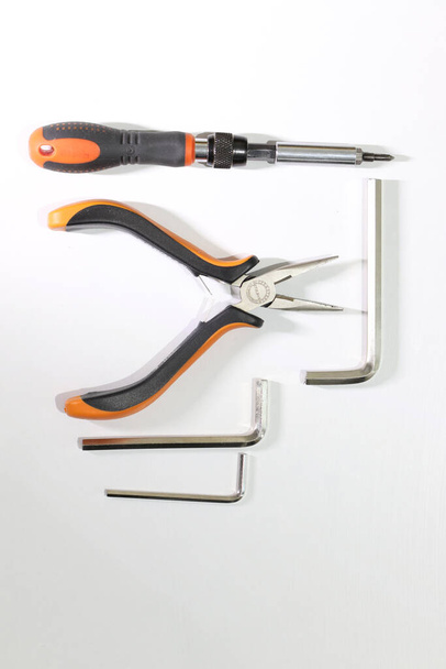 Hand tools, pliers, allen wrench  and screwdriver. - Fotoğraf, Görsel