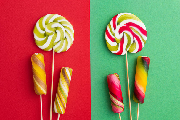 Lollypops candy in trend pastel colors. Pop Art. Summer kids food. Minimal wallpaper. Flat Lay. Top view. - Photo, Image
