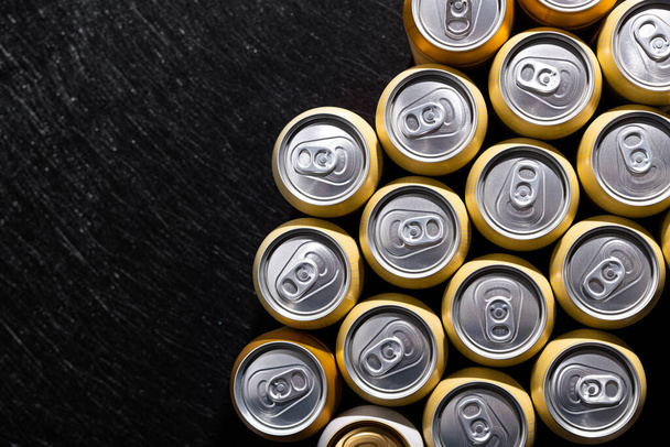 Many cans of beer on a background. top view. - Фото, зображення
