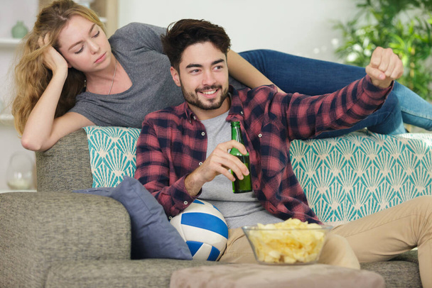 couple in conflict watching tv silently ignoring each other - Photo, Image
