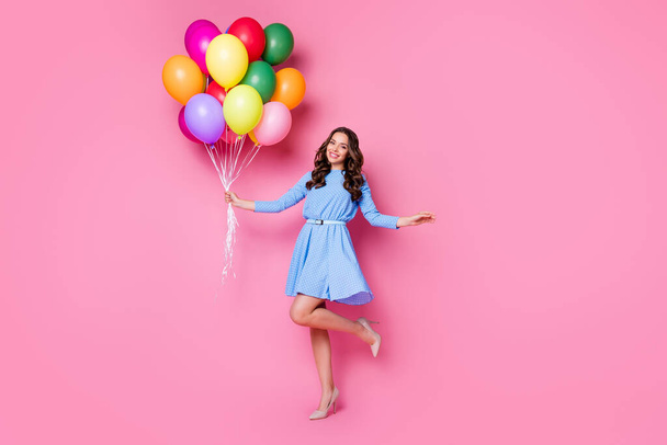 Full length body size view of her she nice attractive lovely stunning exquisite cheerful wavy-haired lady holding in hand bunch air balls having fun posing isolated pink pastel color background - Фото, зображення