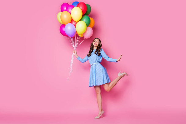 Full length body size view of her she nice attractive pretty cheerful wavy-haired lady holding in hand bunch air balls having fun jubilee posing good mood isolated pink pastel color background - Fotó, kép