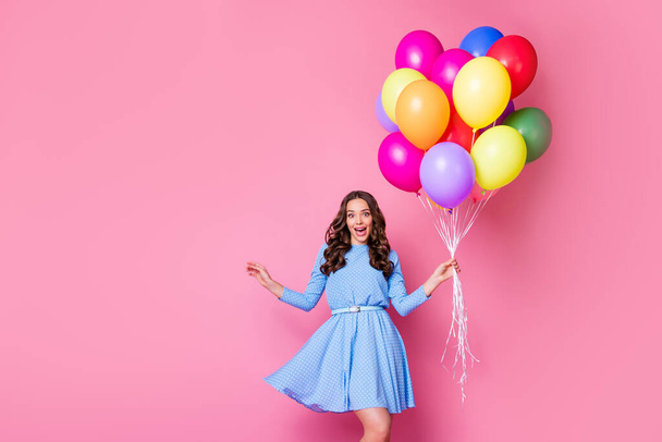 Portrait of her she nice-looking attractive lovely glad funky girlish cheerful wavy-haired lady holding in hand bunch air balls Black friday sale shop isolated pink pastel color background - Valokuva, kuva