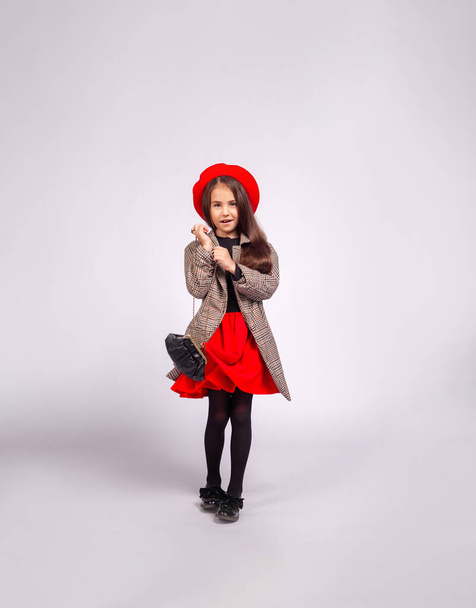 girl in beret and coat with - Фото, изображение