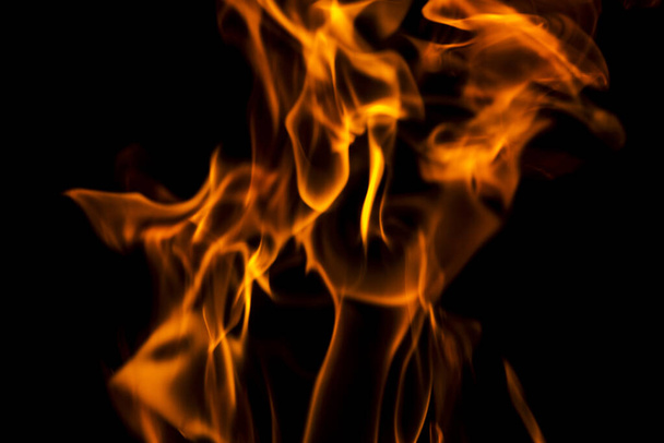 Fire flames abstract on black background. Fire and burning flame on dark background. - Photo, Image