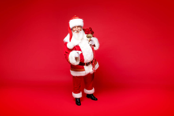Christmas are coming! Real Santa Claus posing on red studio background. - Φωτογραφία, εικόνα