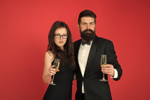 Celebrating their love. Occasion to celebrate. Couple in love drink sparkling wine. Attractive woman bearded man raise glasses. Family celebrate Valentines day. Romantic relationship. Love concept - Zdjęcie, obraz
