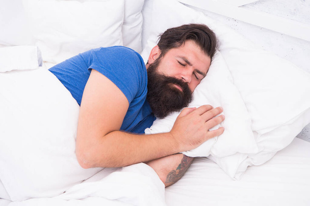 Peaceful morning. early morning. getting the rest your body needs. bed is so comfortable. peaceful mature male relaxing. bearded man sleeping in bed. sleepy guy relax in bedroom - Foto, Imagen