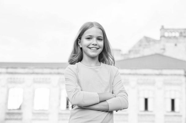 express confidence. cute smiling confident schoolgirl. childhood happiness. back to school. Cheerful kid with casual look. Ending of school year. teen student has blonde hair. full of confidence - Valokuva, kuva