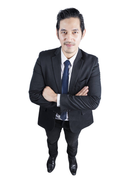 Asian businessman standing with crossed arms isolated over white background - Photo, Image