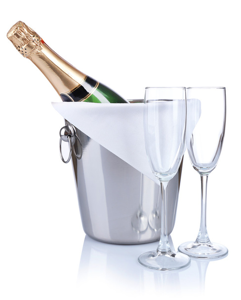 Bottle of champagne in pail and empty glasses, isolated on white - Photo, Image