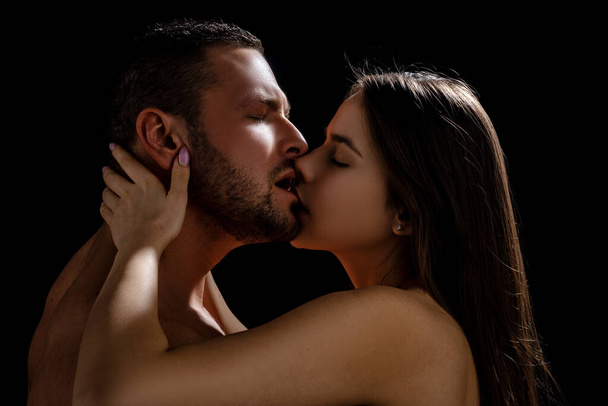 Kissing couple in love. Intimate foreplay of attractive lovers. - Zdjęcie, obraz