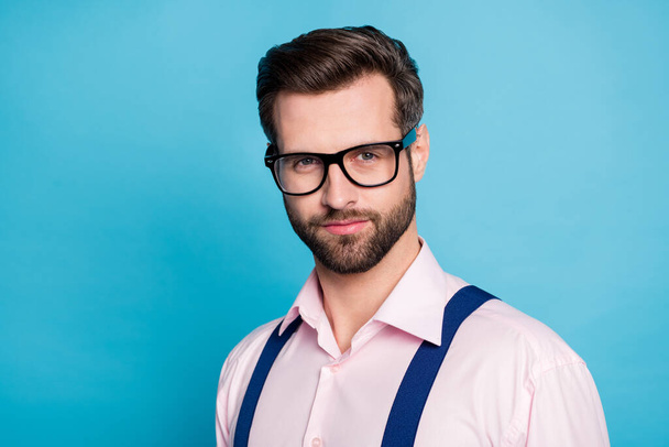 Closeup photo of handsome macho business man cool clothes guy smile without teeth eyesight care vision specs wear pink shirt suspenders isolated pastel blue color background - 写真・画像