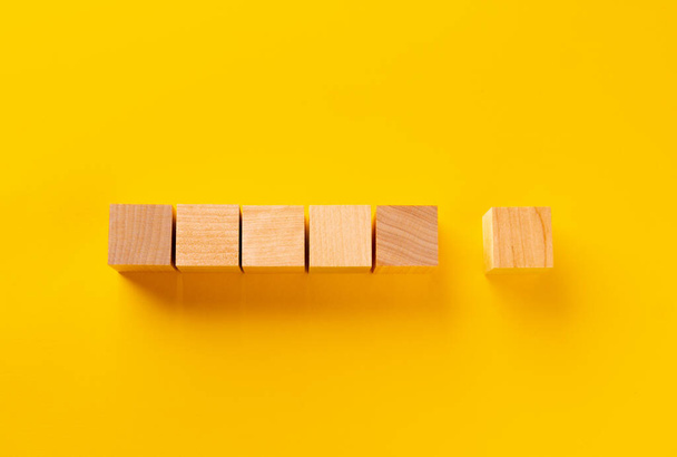 Top view of wooden cubes on yellow - Photo, image