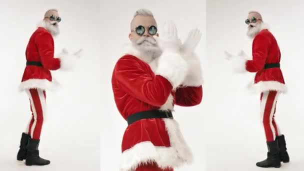 Energetic fun active Santa dances on modern celebration of New Year, Christmas - Materiał filmowy, wideo