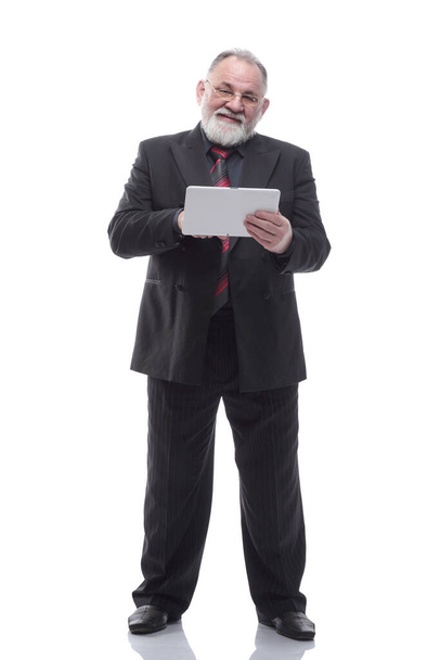 Mature businessman using a digital tablet . isolated on a white - Фото, зображення