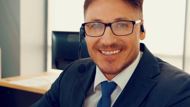 Business people wearing headset working in office - Photo, Image