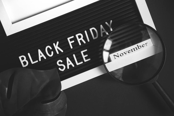 Black Friday sale. black composition top view and flat lay. white alarm clock and keyboard on desktop. - Zdjęcie, obraz
