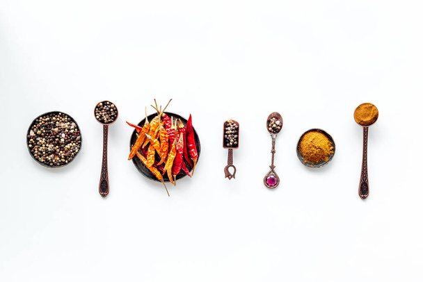 A set of fragrant hot spices - pepper and paprika with herbs, top view - Фото, зображення