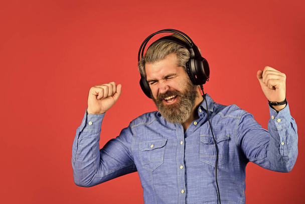 Music beat. Rhythm concept. Man bearded hipster headphones listening music. Hipster enjoy excellent sound song in earphones. Excellent music playlist. Noise cancellation function. Professional gadget - Fotó, kép
