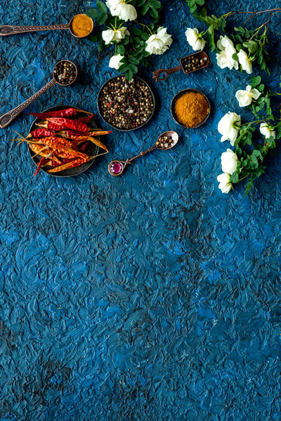 A set of fragrant hot spices - pepper and paprika with herbs, top view - Fotografie, Obrázek