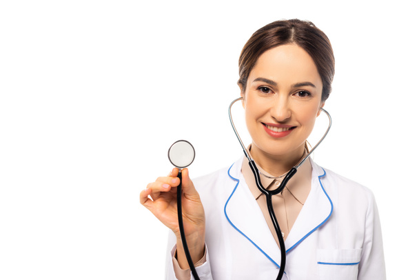 Doctor with stethoscope looking at camera isolated on white - Foto, Imagem