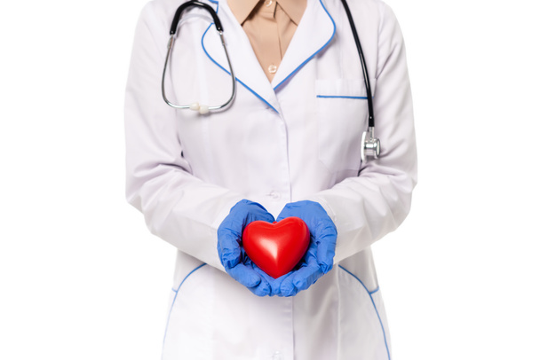 Cropped view of doctor holding red heart isolated on white - Photo, image