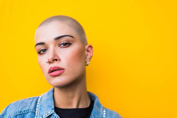 Pretty girl with stylish clothes posing - Beautiful woman with shaved head portrait - Photo, image