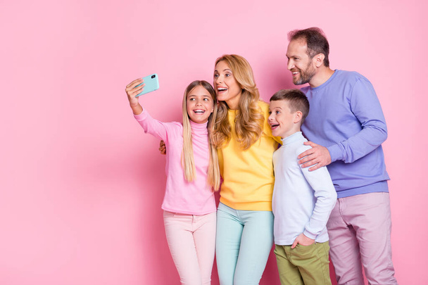 Photo of positive dream small girl take selfie dad mom brother on smartphone isolated over pastel color background - Fotoğraf, Görsel