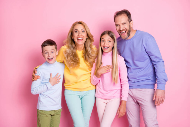Photo of positive cheerful family looking into camera laughing isolated over pastel color background - Fotografie, Obrázek