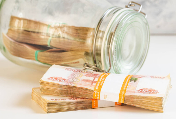 Russian money in a glass jar. - Foto, immagini