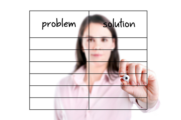 Young business woman writing problem and solution list in blank. - Photo, Image