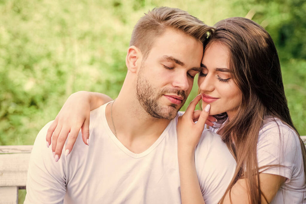 Love you tender. couple in love. Skin and hair care. family weekend. romantic date. girl with guy in park. Beauty and fashion. happy valentines day. summer vibes. couple relax outdoor. Tender feeling - Foto, imagen