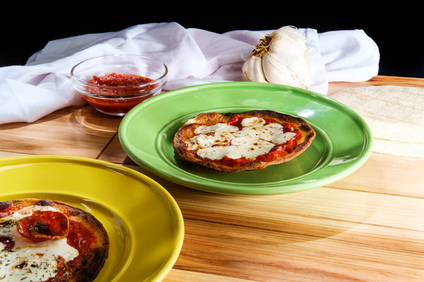 Gluten free crust tortilla taco pizza with tomato sauce and mozzarella cheese - Photo, Image