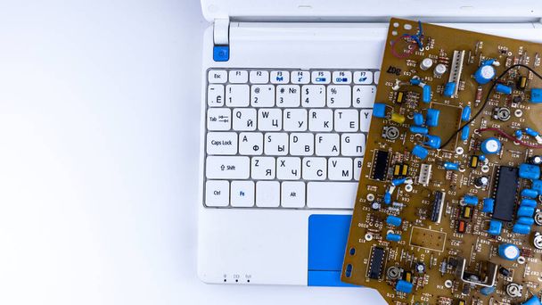 motherboard from an old computer, on a white laptop - Photo, Image