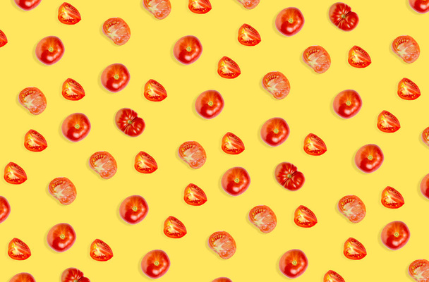 Tomato abstract background. Set of ripe tomato and slices, yellow backdrop, top view, flat lay. - Foto, afbeelding