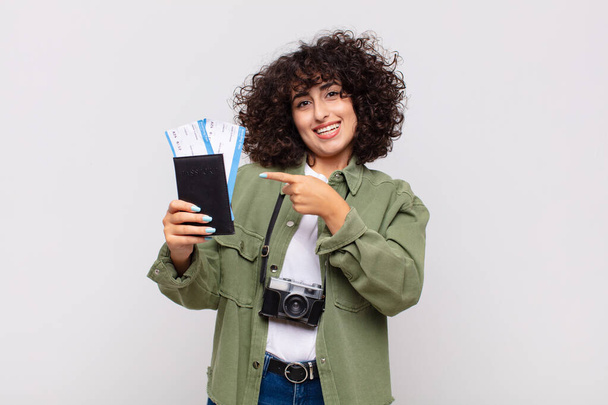 arab pretty woman with a plane an boarding tickets. travel concept - 写真・画像