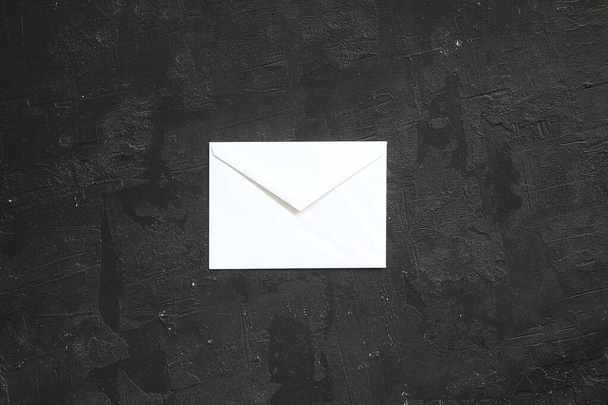 White paper envelopes on black background, flat lay - Fotoğraf, Görsel