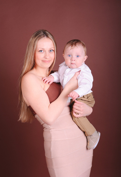 Mother holding boy - Photo, Image