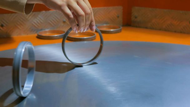 Moving rings on metal turning surface - Photo, Image